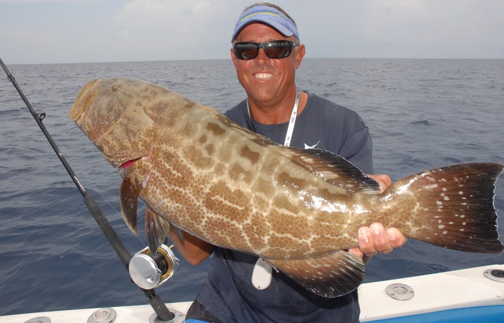 Capt. Ryan Van Fleet from Good Karma Sportfishing in Tavernier, FL with a big black grouper