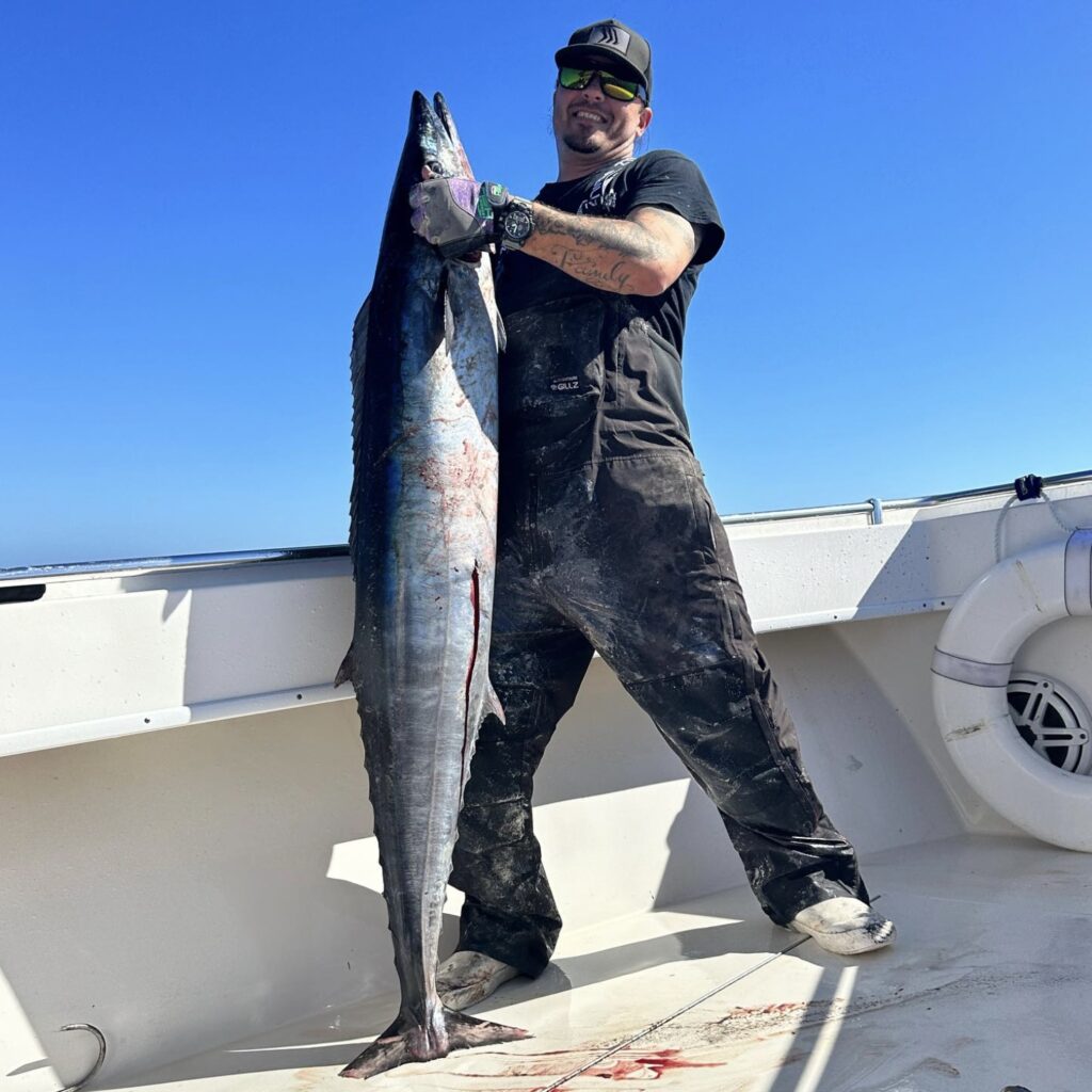 Captain Mike Dupree holding a wahoo