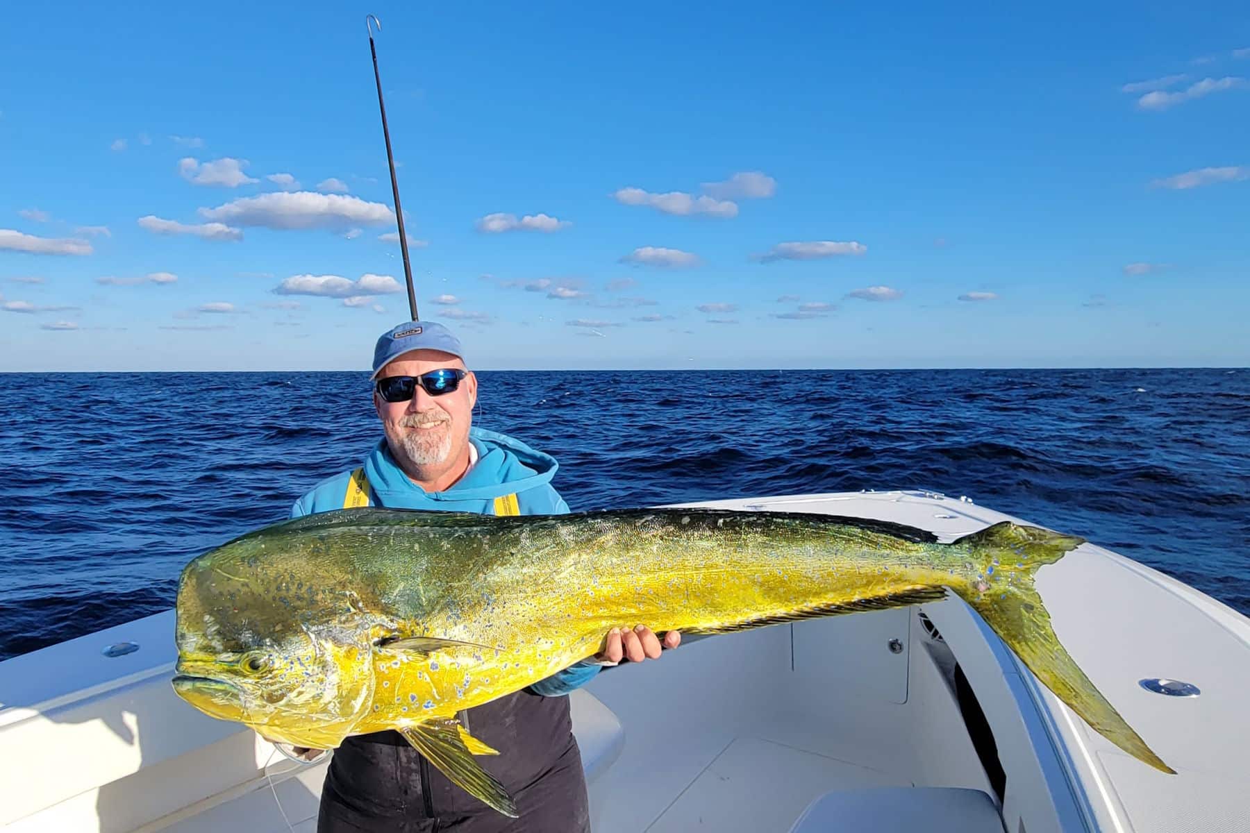 Capt. Scott Goodwin holding a large "bull" dolphin aka mahi mahi or dorado