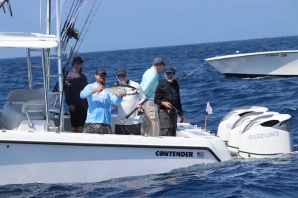 angler holding a blackfin tuna caught in Florida Keys with Captain Trosset